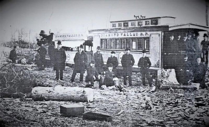 Diamond Valley Railroad cars and a group of men