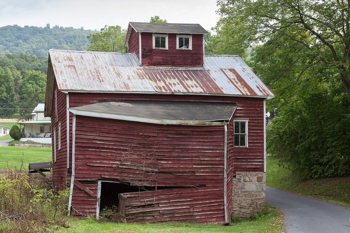 Hudson Grist Mill, the west side and shed addition, and the remains of a Fitz steel water wheel